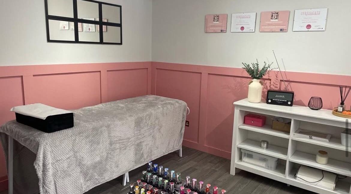 Cozy treatment room at The Beauty Room, Wooler, England, GB, with massage table and elegant decor.