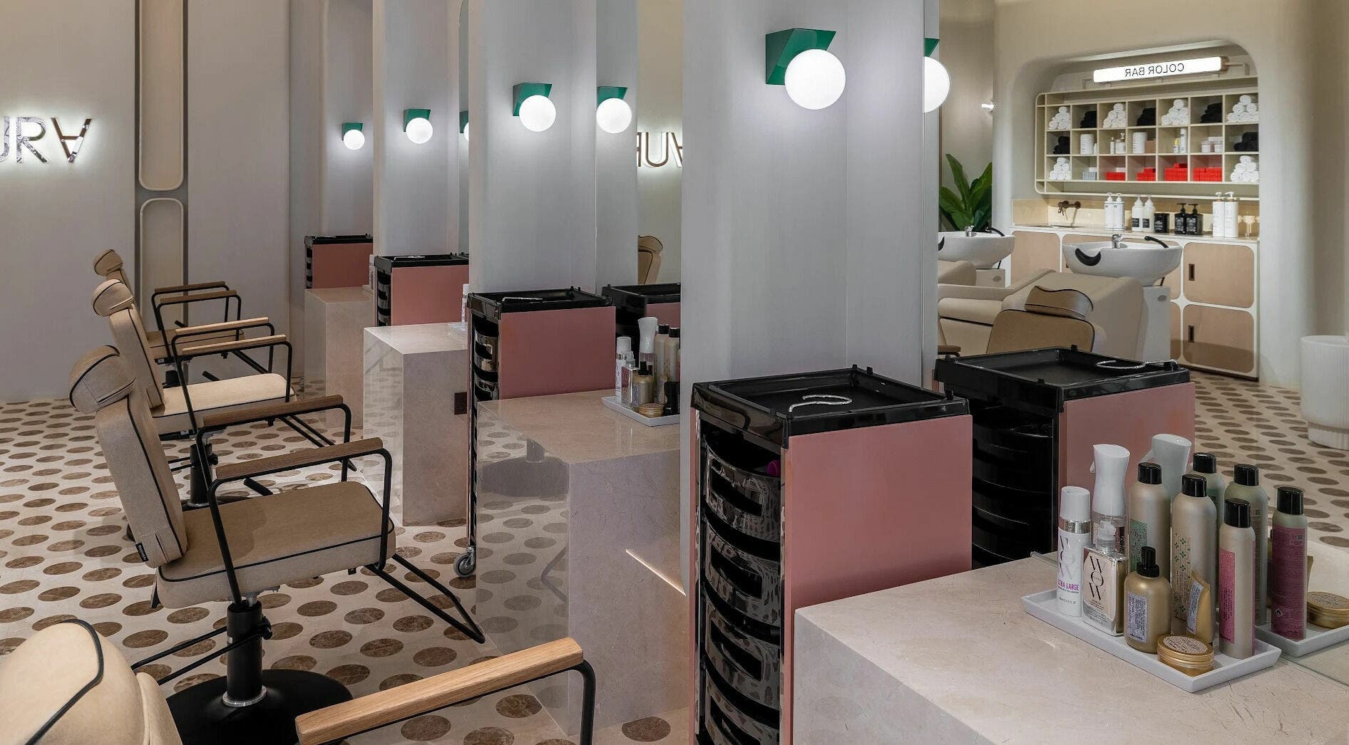 Modern salon interior at AURA - Riyadh, featuring elegant styling stations in Riyadh, Riyadh Province, SA.