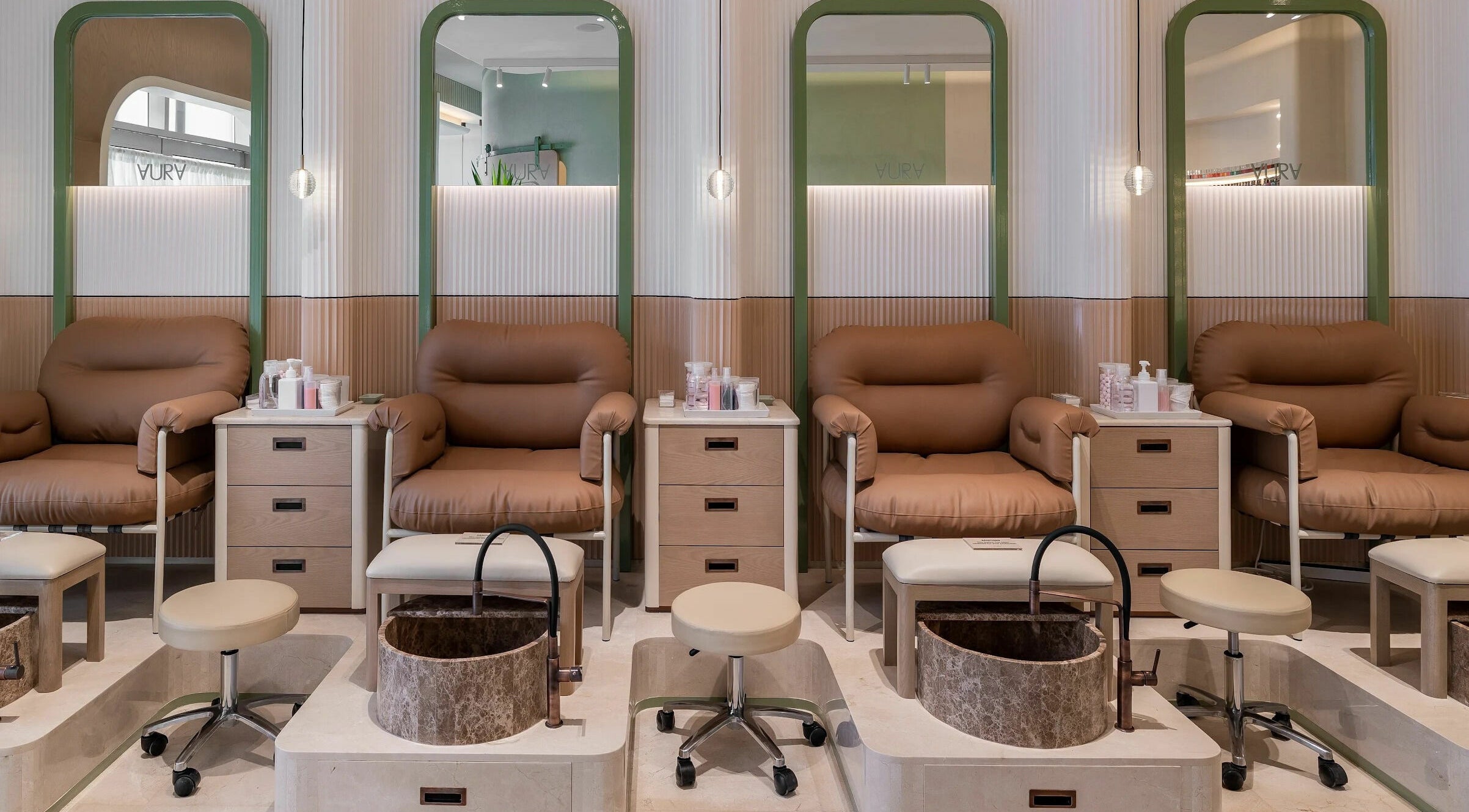 Comfortable pedicure chairs at AURA - Riyadh, Riyadh, Riyadh Province, SA, showcasing a calm ambiance.
