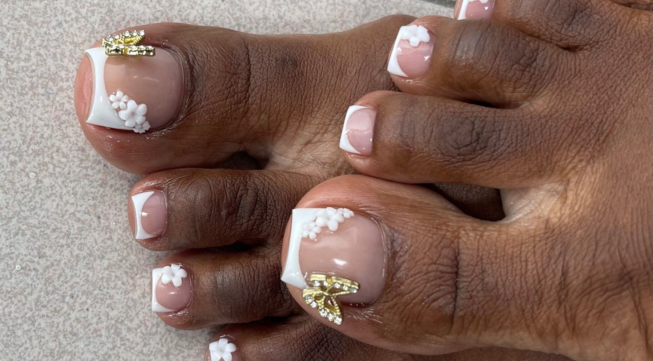 Close-up of floral nail art on toes at SensatioNailz Studio, Bridgetown, Saint Michael, BB.