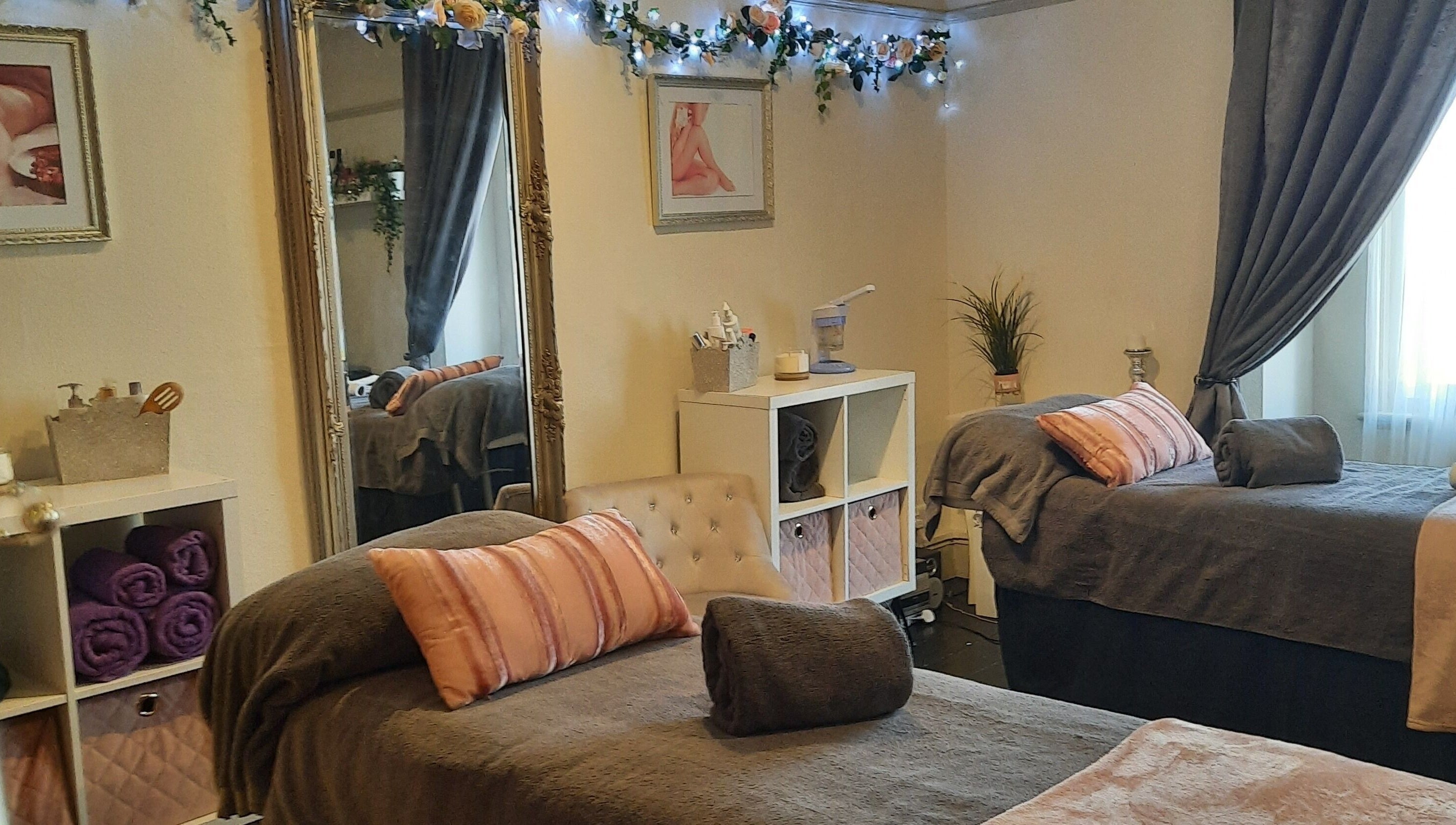 Relaxing treatment room at Venus Beauty, Derby, England, GB, featuring cozy beds and elegant decor.