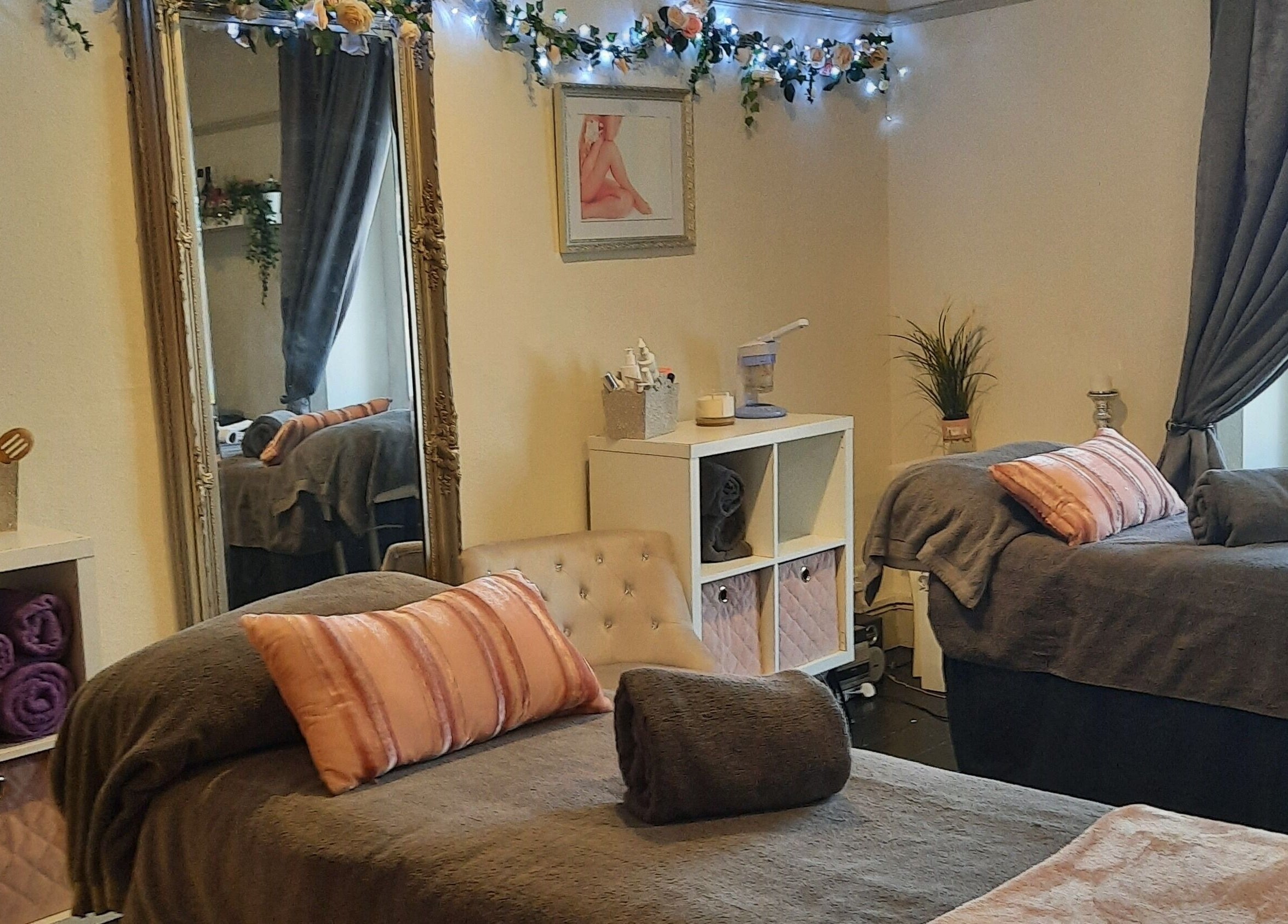 Relaxing treatment room at Venus Beauty, Derby, England, GB, featuring cozy beds and elegant decor.
