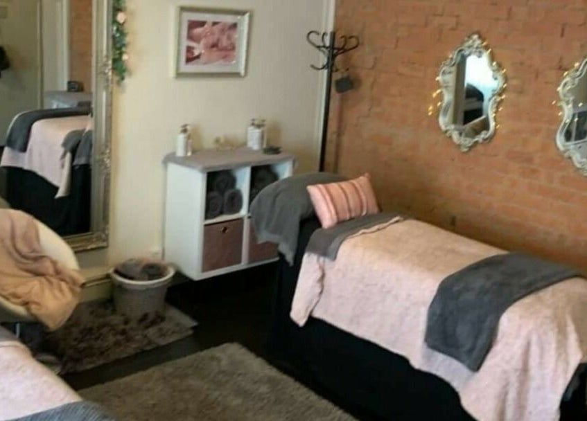 Cozy treatment room at Venus Beauty, Derby, England, GB with stylish decor and soft ambiance.