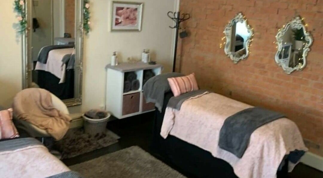 Cozy treatment room at Venus Beauty, Derby, England, GB with stylish decor and soft ambiance.