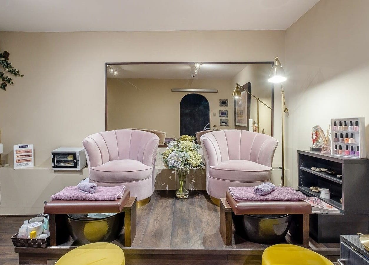Elegant pedicure chairs in Studio 52 Hair and Beauty, London, England, GB, showcasing luxury and comfort.