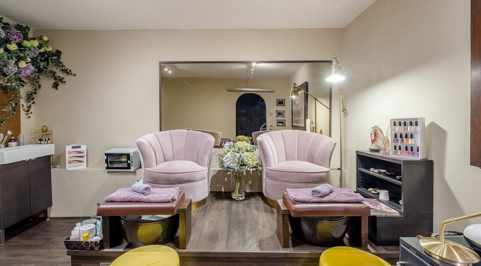 Elegant pedicure chairs in Studio 52 Hair and Beauty, London, England, GB, showcasing luxury and comfort.