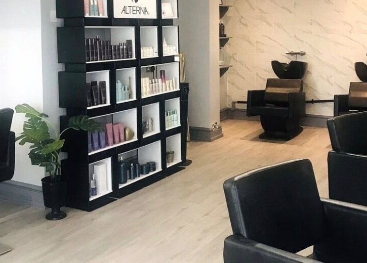 Modern salon interior of Kerry Wright Aesthetics at Lostock Hall, Lostock Hall, England, GB with sleek chairs and shelves.