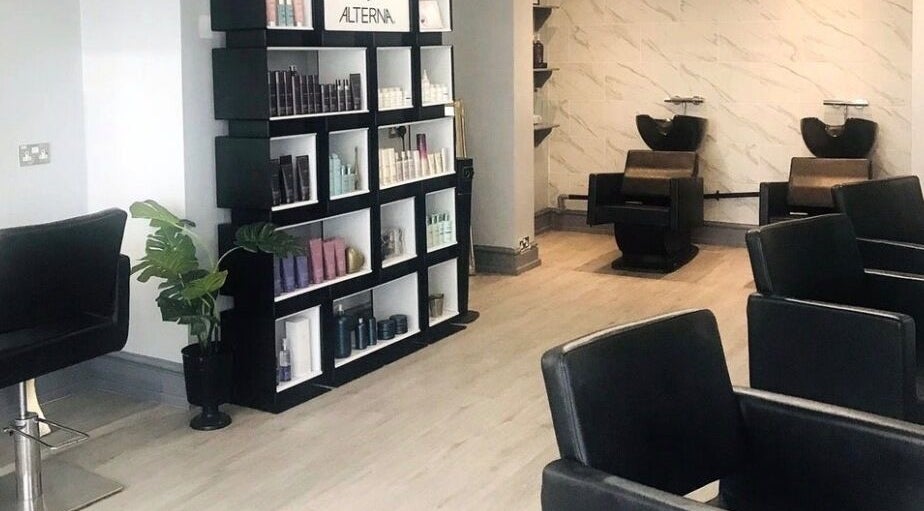Modern salon interior of Kerry Wright Aesthetics at Lostock Hall, Lostock Hall, England, GB with sleek chairs and shelves.