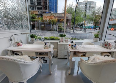 Elegant nail stations at Prép Beauty Parlour, Vancouver, British Columbia, CA with street view backdrop.