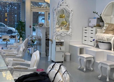 Elegant interior of Prép Beauty Parlour in Vancouver, British Columbia, CA featuring luxurious white seating.