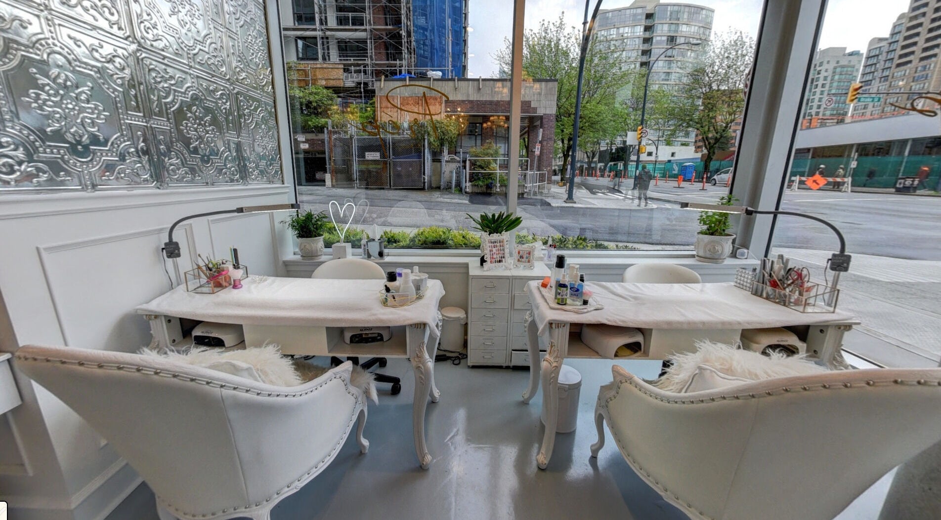 Elegant manicure stations at Prép Beauty Parlour, overlooking bustling Vancouver streets in British Columbia, CA.