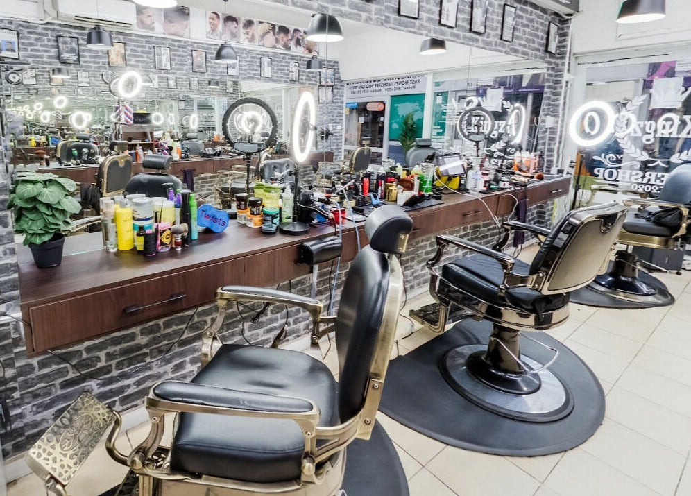 Kingz Barbershop's sleek interior with barber chairs and mirrors in Moorooka, Queensland, AU. 
