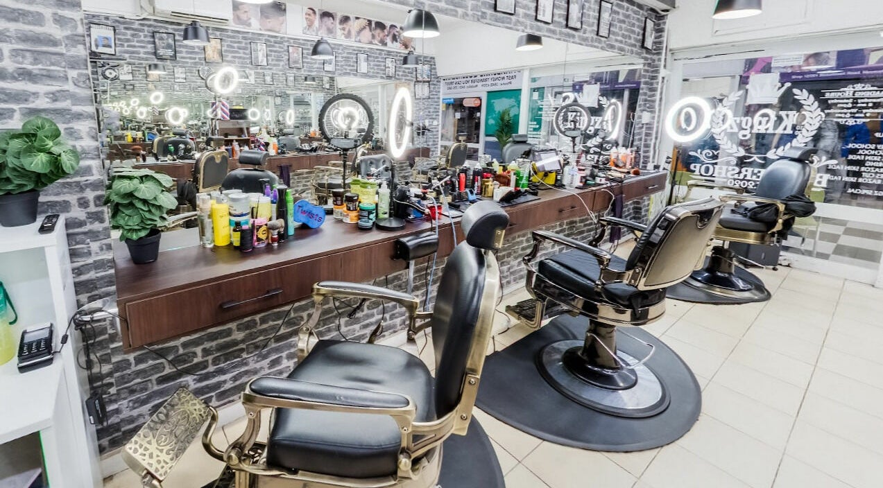 Kingz Barbershop's sleek interior with barber chairs and mirrors in Moorooka, Queensland, AU. 