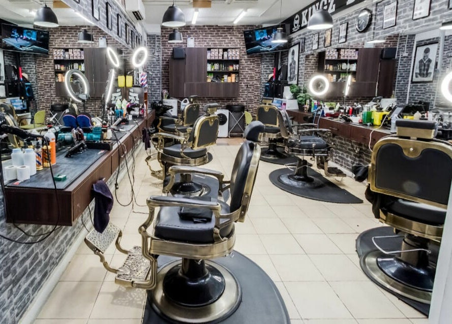 Interior of Kingz Barbershop, Moorooka, Queensland, AU showcasing classic barber chairs and modern lighting.