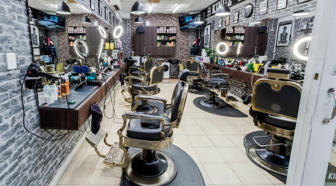 Interior of Kingz Barbershop, Moorooka, Queensland, AU showcasing classic barber chairs and modern lighting.