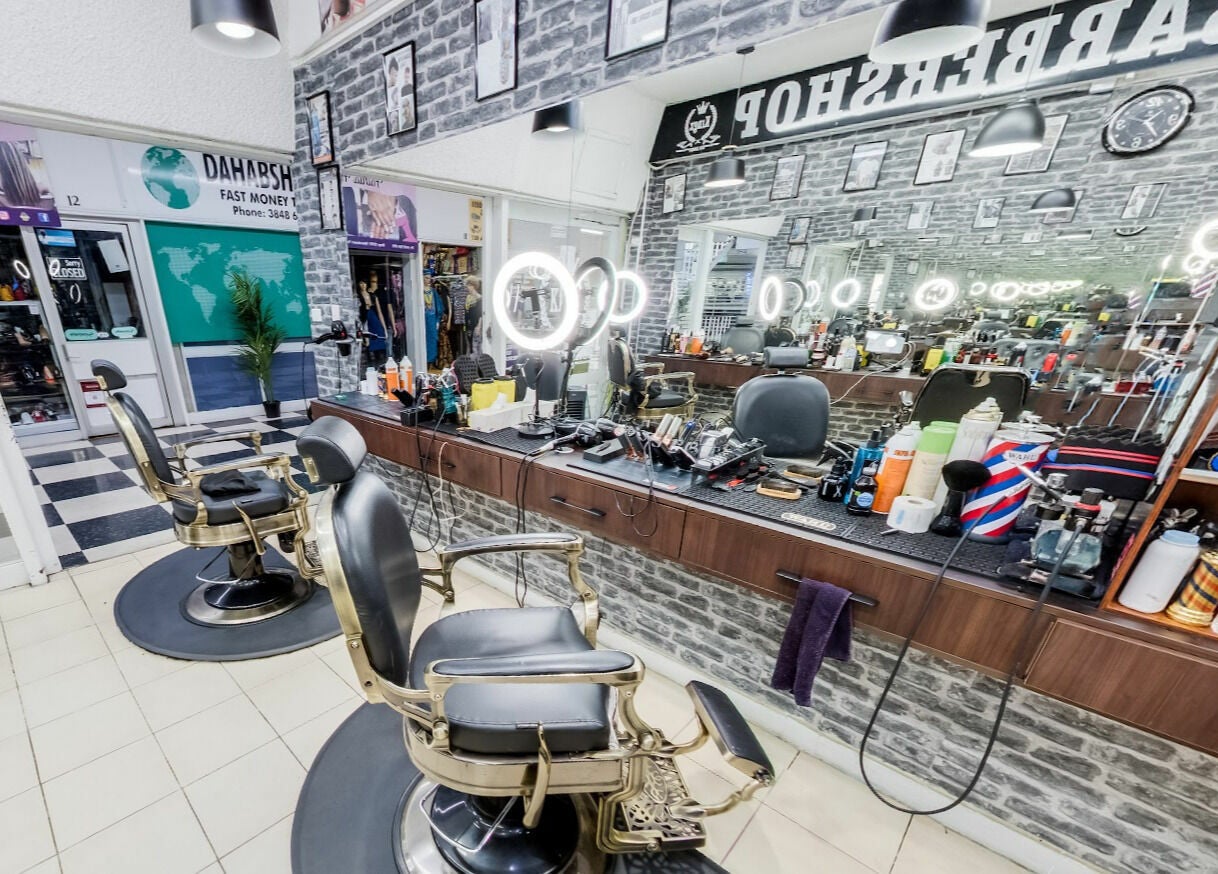 Modern interior of Kingz Barbershop in Moorooka, Queensland, AU with sleek barber chairs and grooming tools.