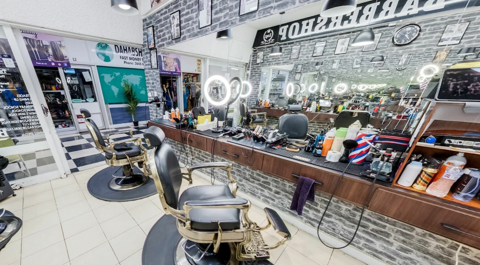 Modern interior of Kingz Barbershop in Moorooka, Queensland, AU with sleek barber chairs and grooming tools.