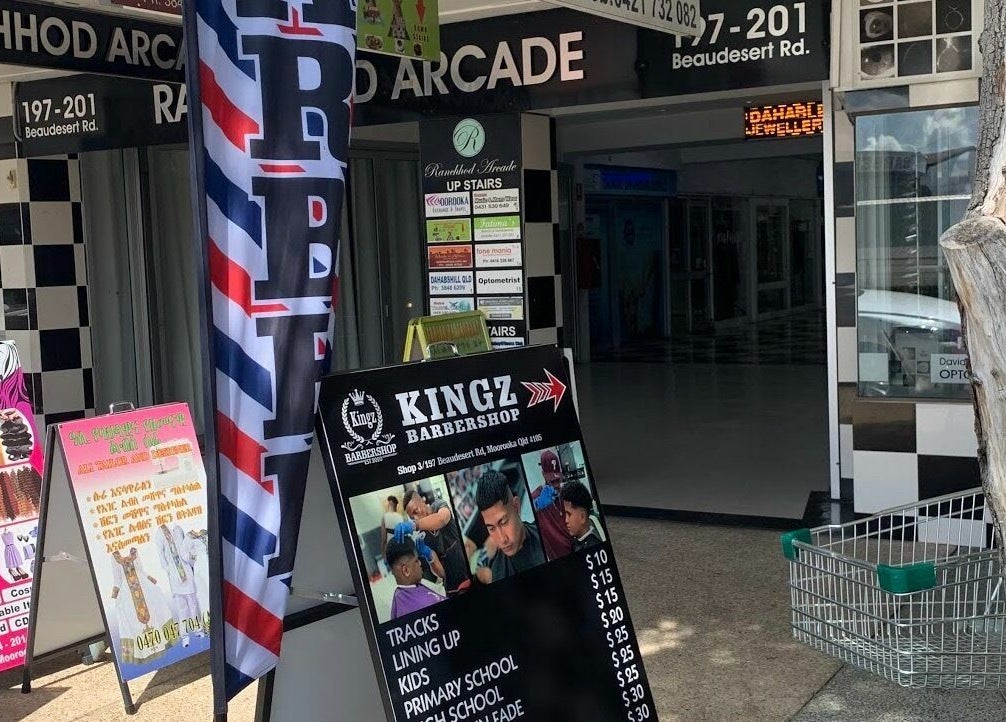 Entrance of Kingz Barbershop at Moorooka, Queensland, AU features vibrant signage and welcoming ambiance.