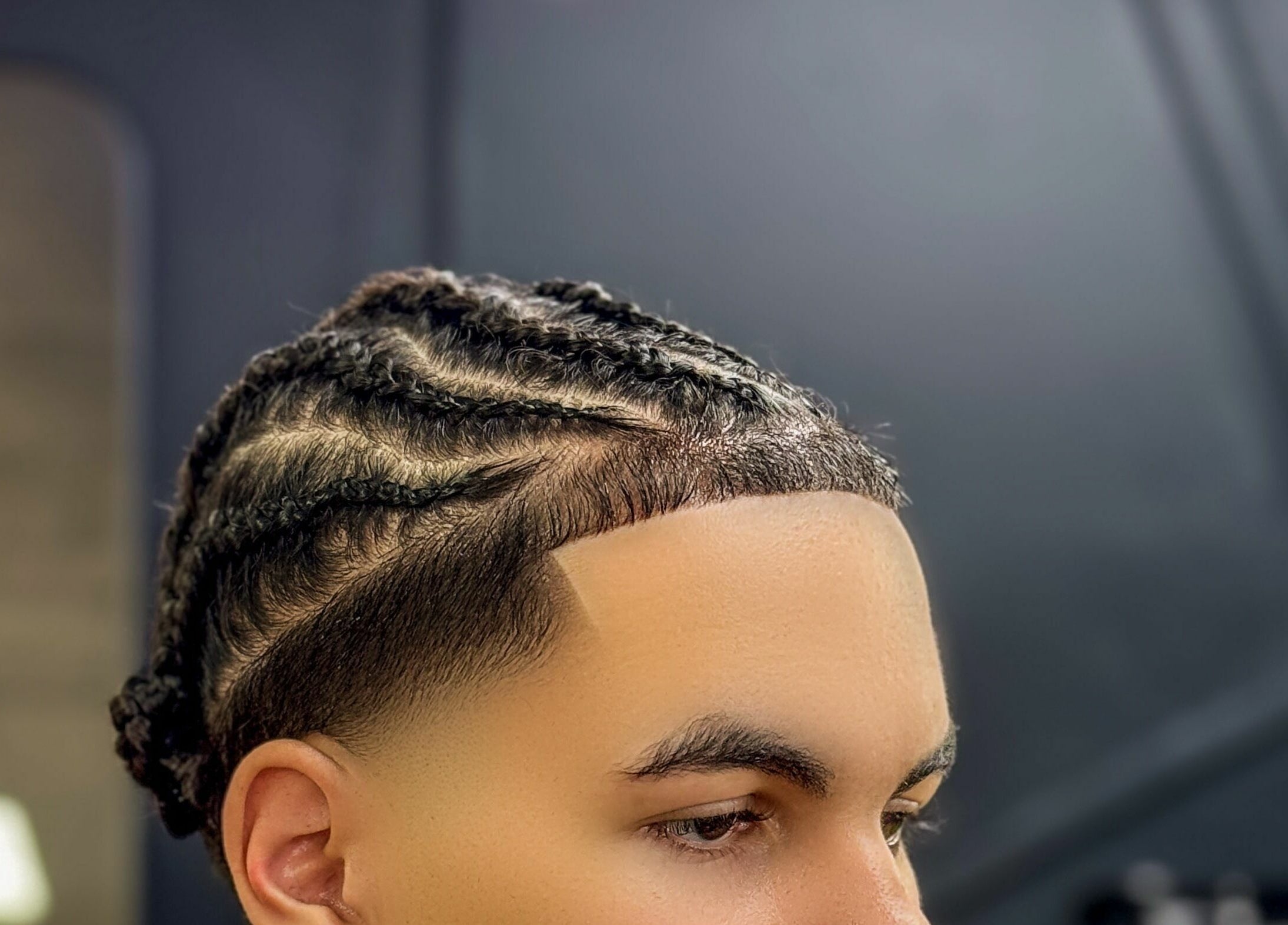 Close-up of intricate braids and fresh trim at Kingz Barbershop in Moorooka, Queensland, AU.