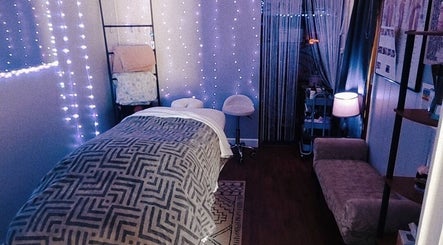 Serene spa room at Braven at Relaxations in Alma, Michigan, US with cozy bed and ambient lighting.