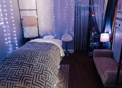 Peaceful spa room at Braven at Relaxations, Alma, Michigan US. Cozy ambiance with soft lighting and recliner.