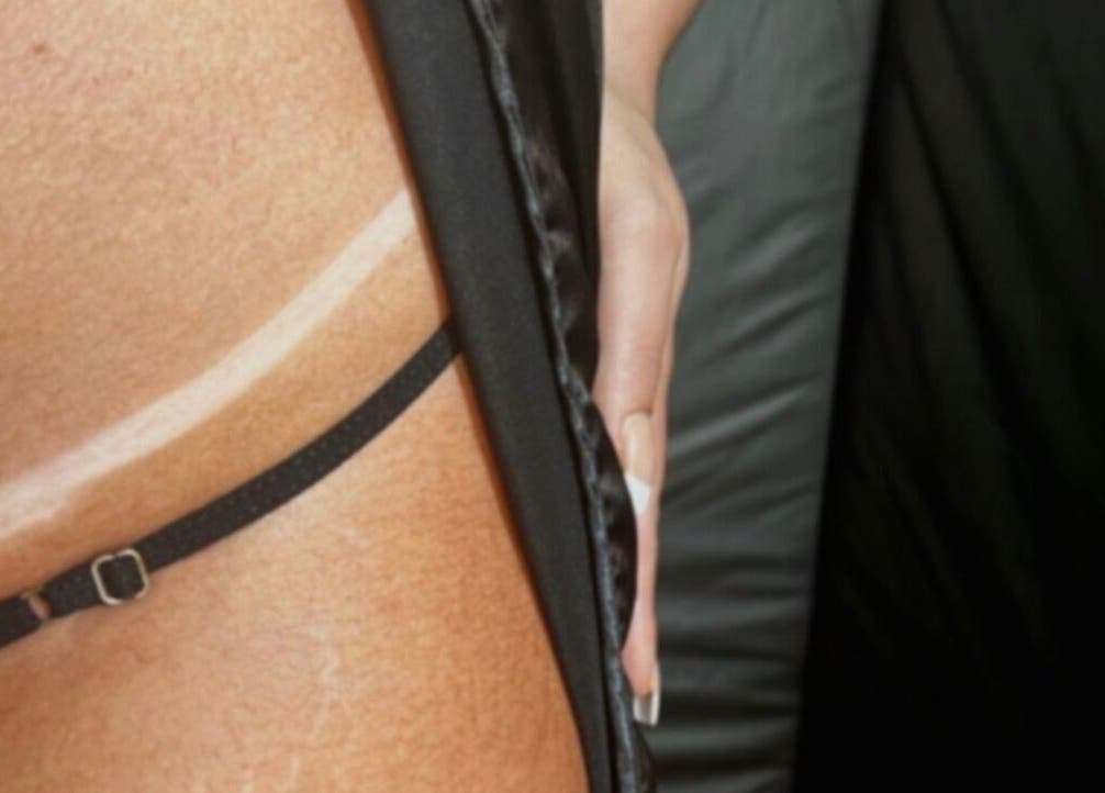 Close-up of a perfectly bronzed silhouette at Bonlaser by Essence, Kralendijk, Bonaire, BQ.