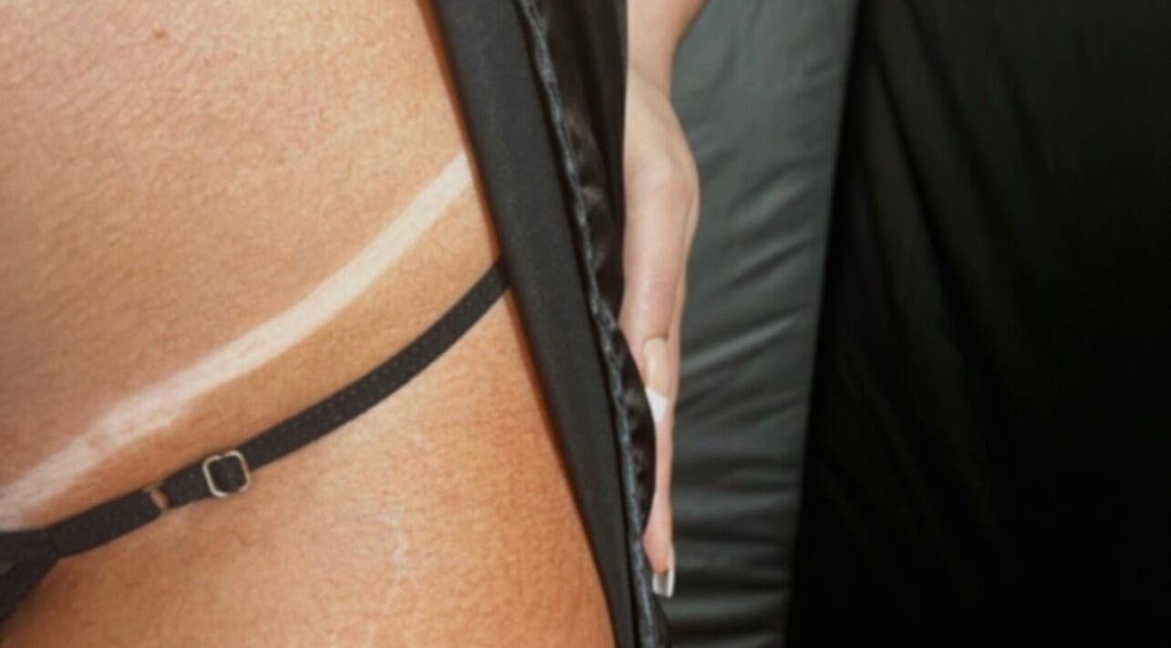 Close-up of a perfectly bronzed silhouette at Bonlaser by Essence, Kralendijk, Bonaire, BQ.