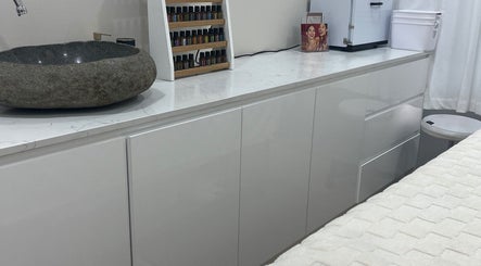 Stone sink and essential oils at Facial Skin Specialist, Smithfield 2164, New South Wales, AU.