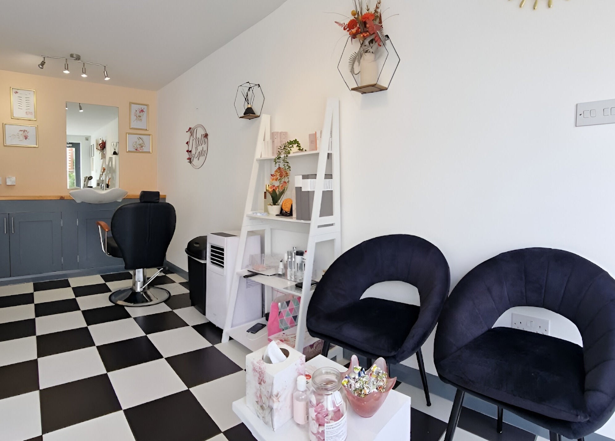 Modern interior of Tania Bhangoo Permanent Makeup in Cambridge, England, GB, featuring black and white decor.
