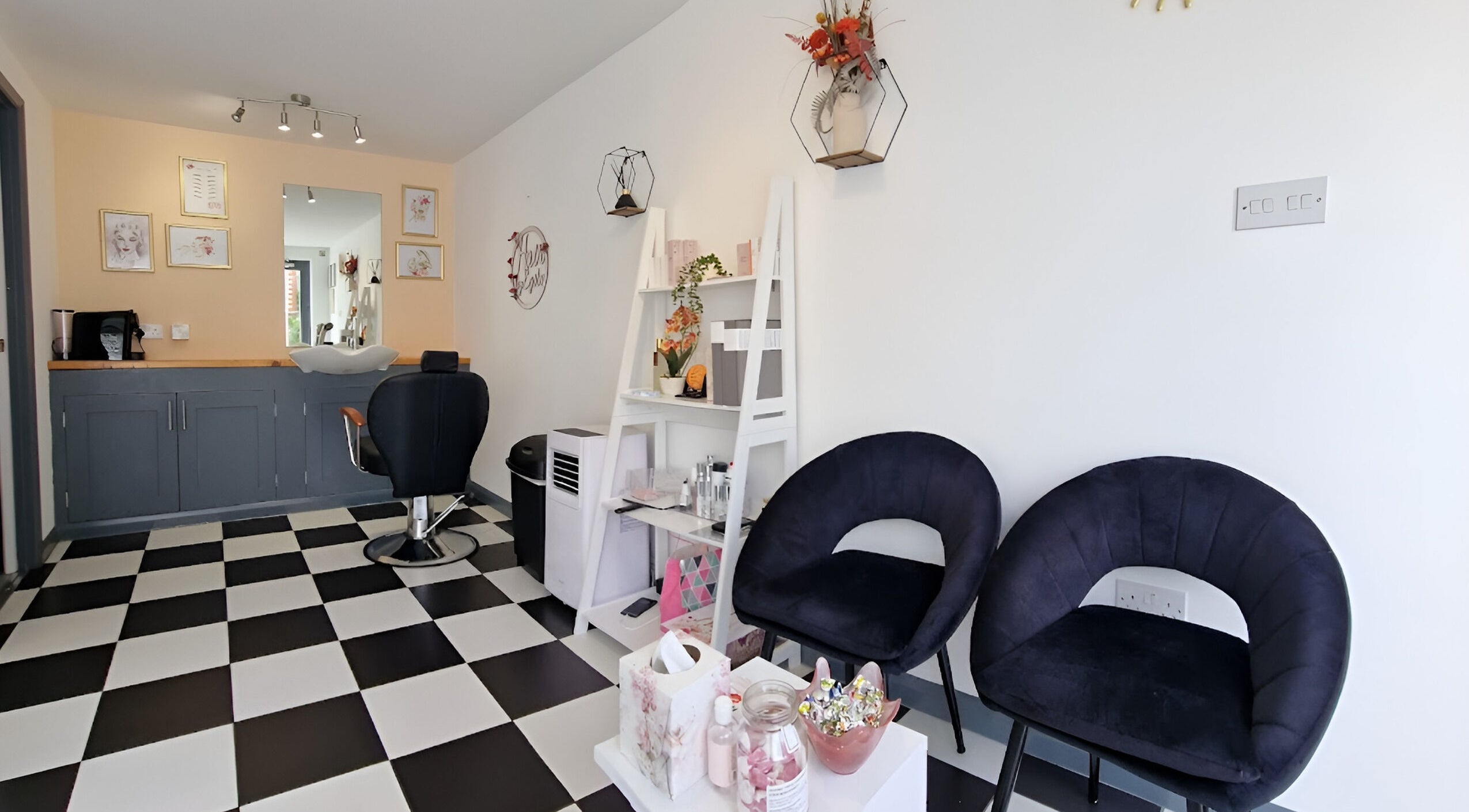 Modern interior of Tania Bhangoo Permanent Makeup in Cambridge, England, GB, featuring black and white decor.