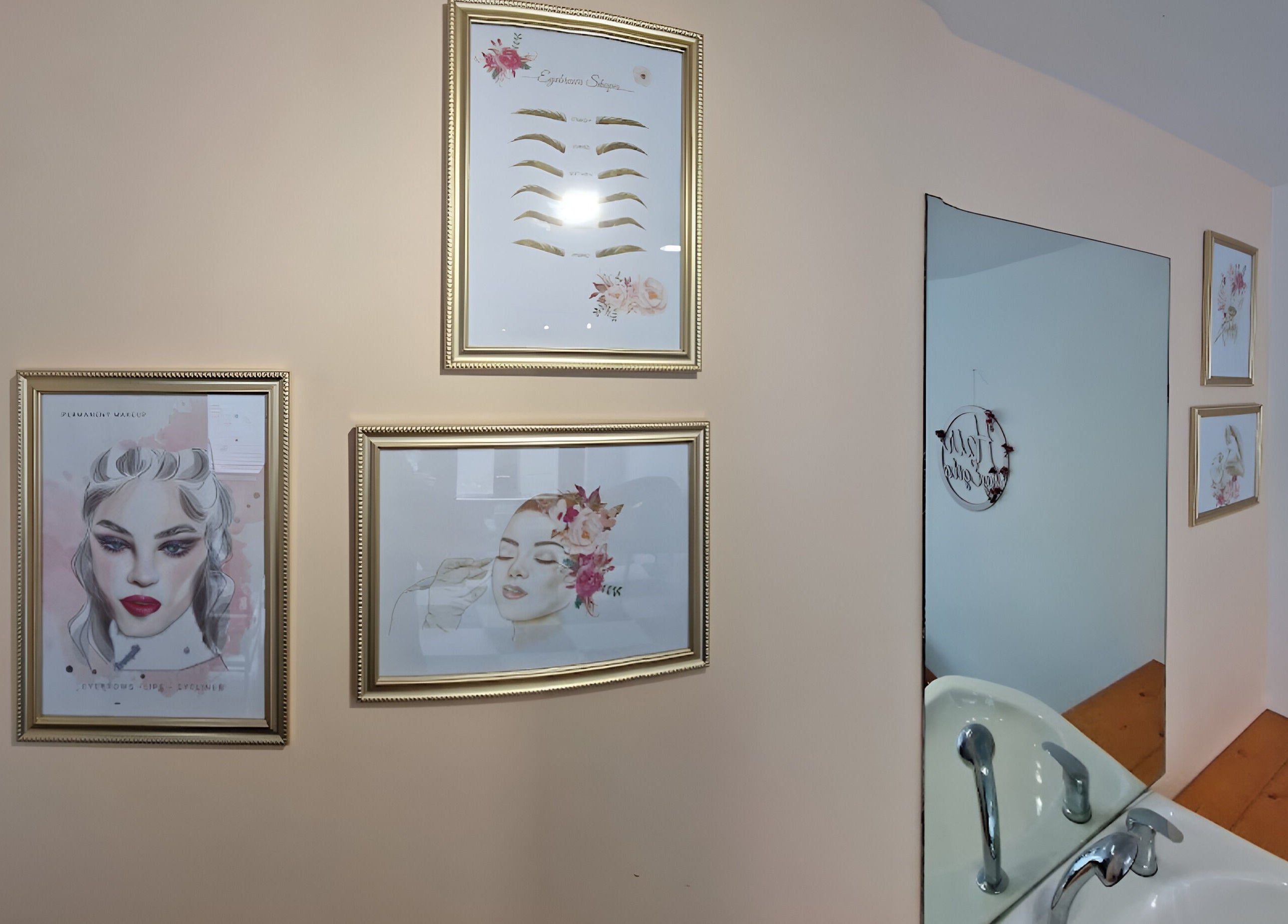 Artistic framed prints and simple sink at Tania Bhangoo Permanent Makeup in Cambridge, England, GB.