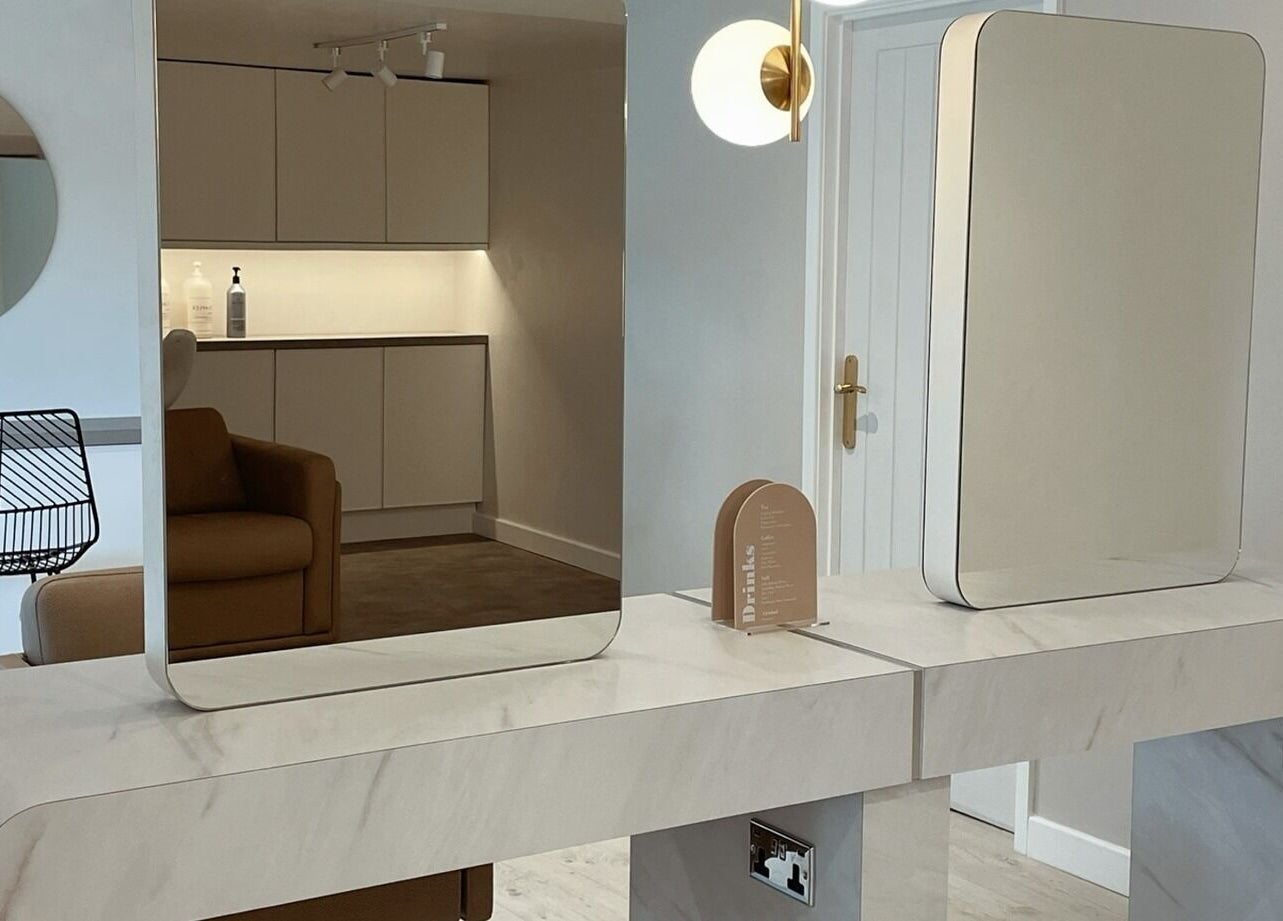 Contemporary salon interior at Jessica Simpson Studio, Tonbridge, England, GB with sleek mirrors and modern decor.