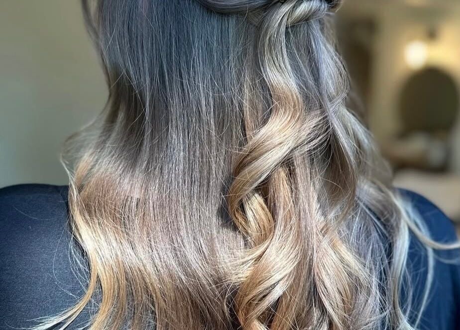 Long wavy hair styled at Jessica Simpson Studio, Tonbridge, England, GB. Shiny and beautifully textured.