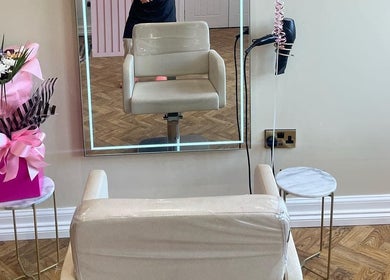 Elegant styling chair and mirror setup at House of GC Salon, Leslie, Scotland, GB. Features floral decor.