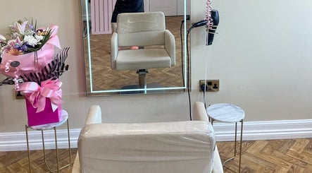 Elegant styling chair and mirror setup at House of GC Salon, Leslie, Scotland, GB. Features floral decor.