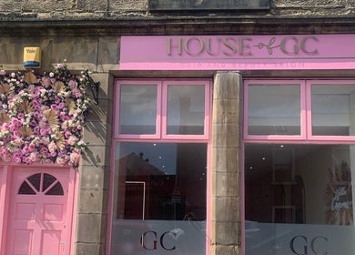 House of GC Salon storefront with pink floral entrance in Leslie, Scotland, GB.