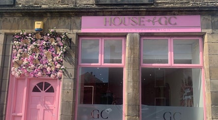 House of GC Salon storefront with pink floral entrance in Leslie, Scotland, GB.