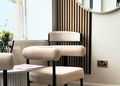Elegant seating area with flowers at House of GC Salon, Leslie, Scotland, GB.