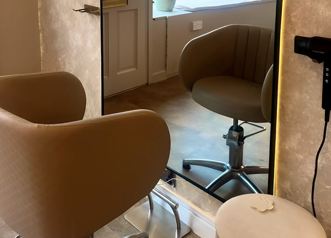Salon chair and mirror setup at Salon Twenty Six in Attleborough, England, GB, highlighting modern elegance.