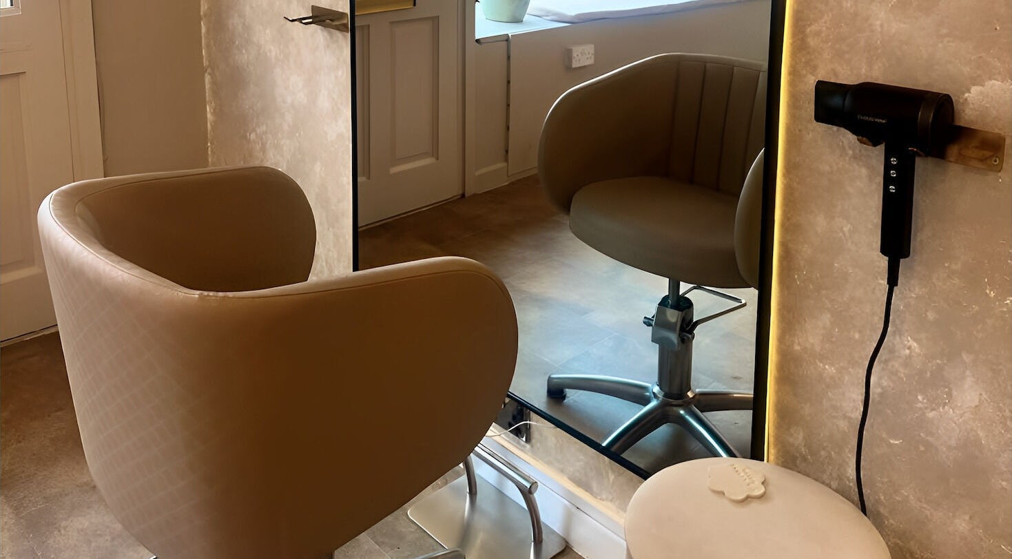 Salon chair and mirror setup at Salon Twenty Six in Attleborough, England, GB, highlighting modern elegance.