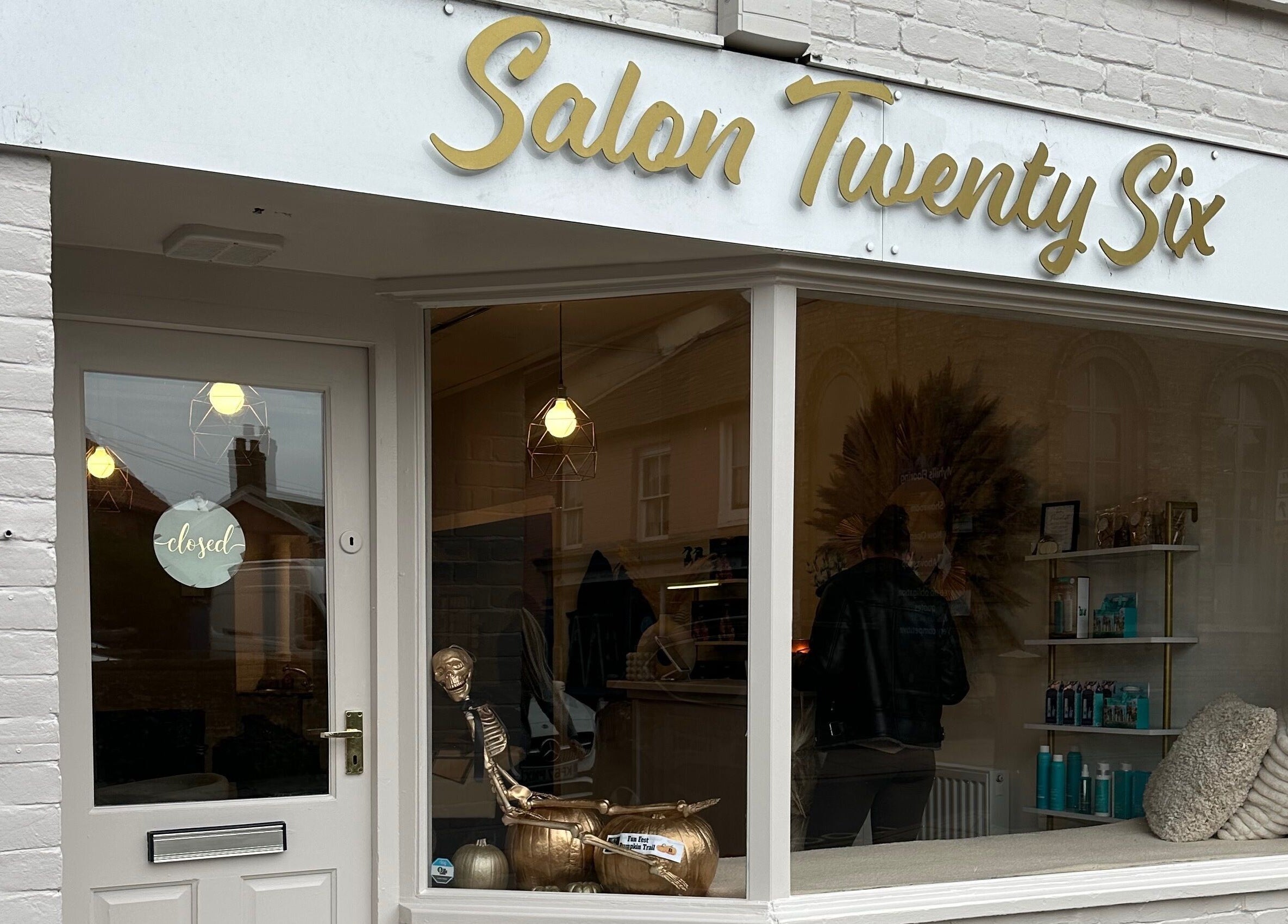 Exterior of Salon Twenty Six in Attleborough, England, showcasing stylish signage and inviting window display.