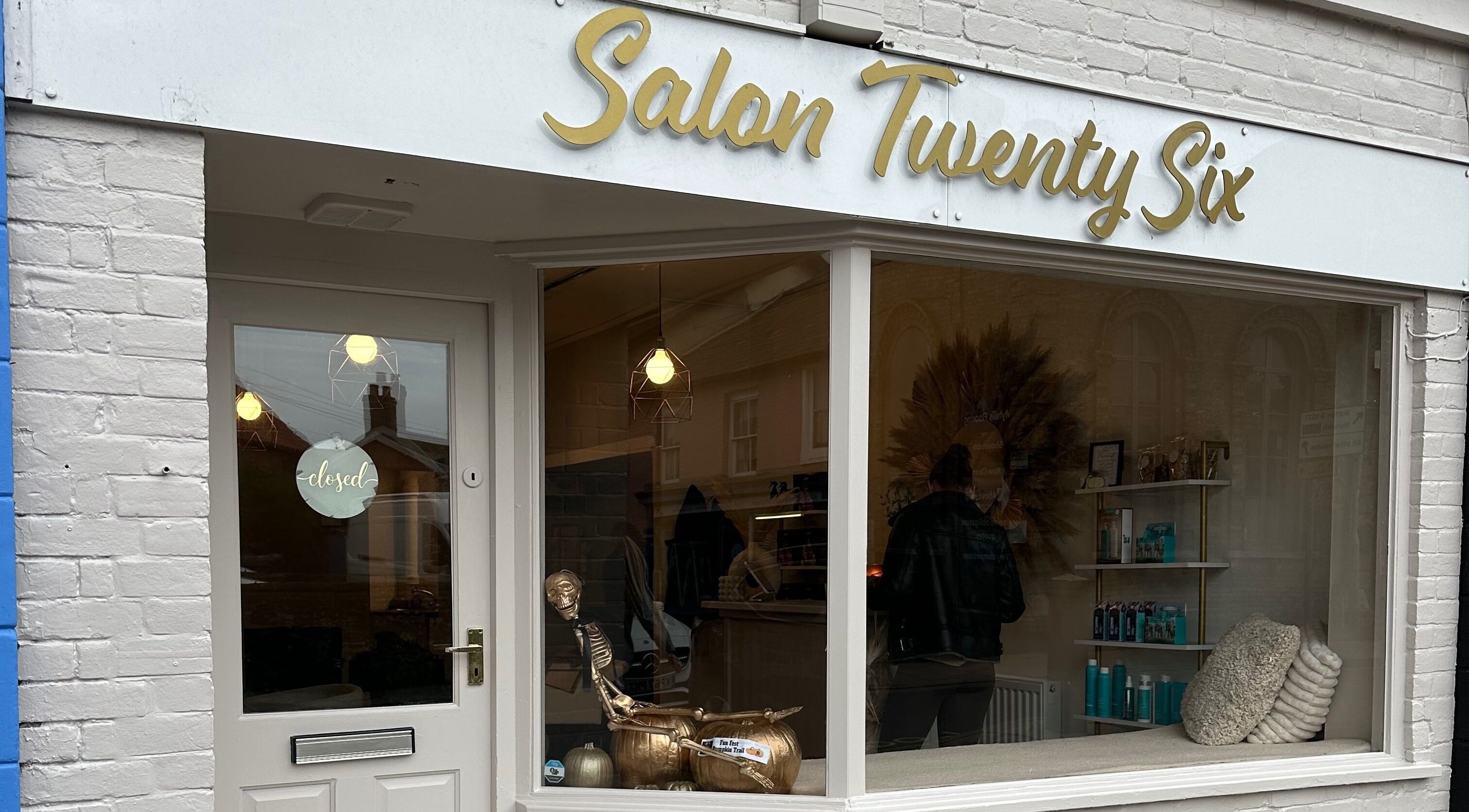 Exterior of Salon Twenty Six in Attleborough, England, showcasing stylish signage and inviting window display.
