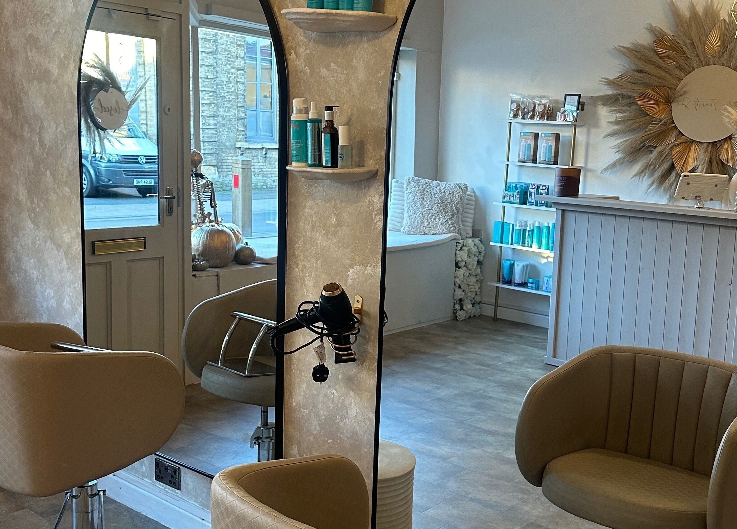 Modern interior of Salon Twenty Six in Attleborough, England, GB with chic chairs and elegant mirrors.