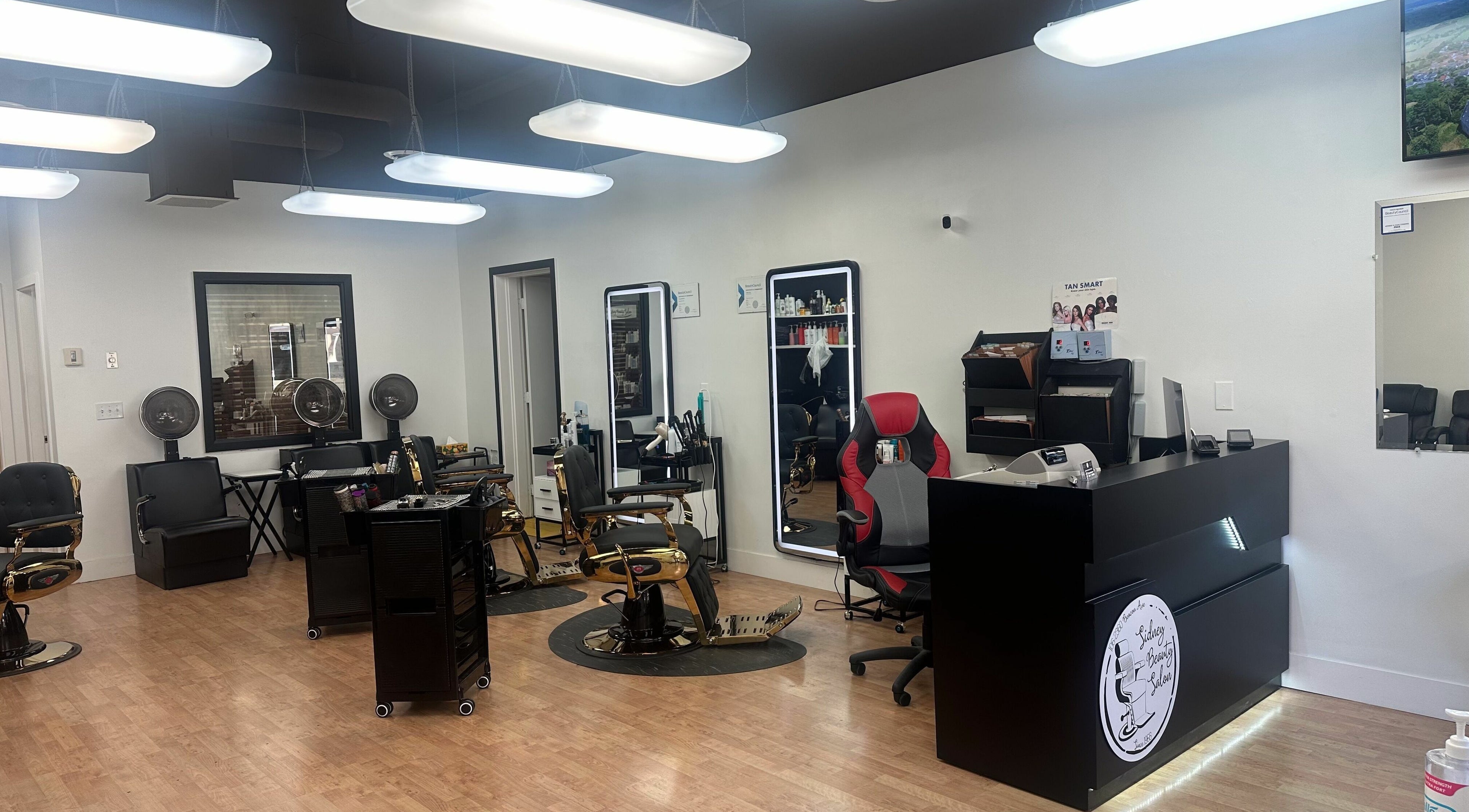 Modern interior of Sidney Beauty Salon & Tanning in Sidney, British Columbia, CA with chic styling chairs and mirrors.