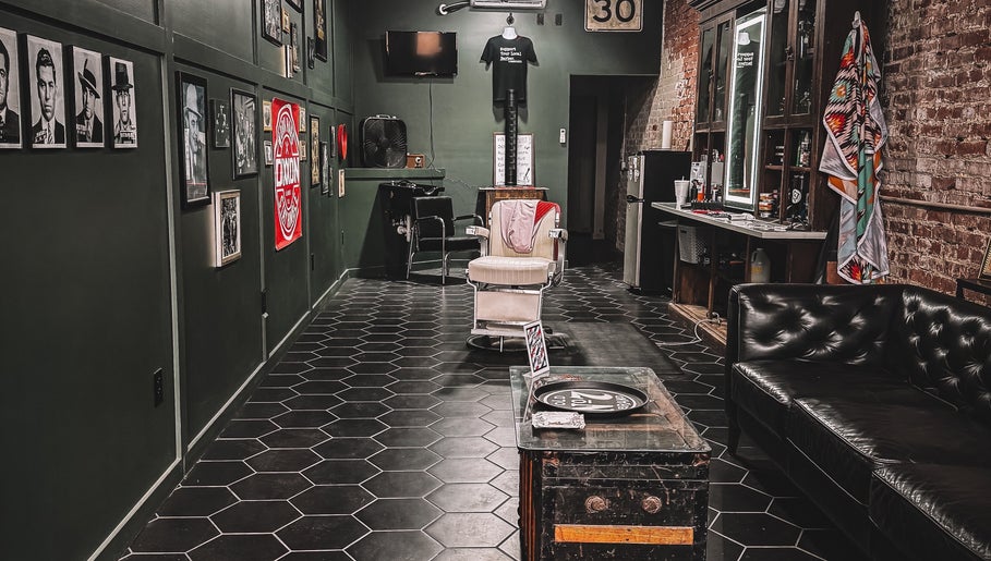 Retro interior of 46 Barber Society in Sperry, Oklahoma, with classic chair and decor.