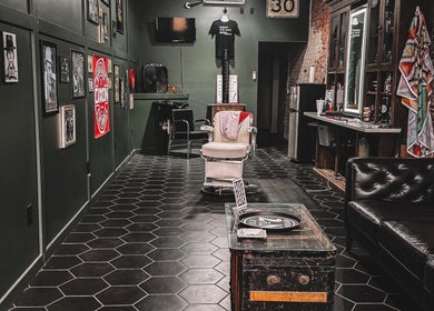 Retro interior of 46 Barber Society in Sperry, Oklahoma, with classic chair and decor.