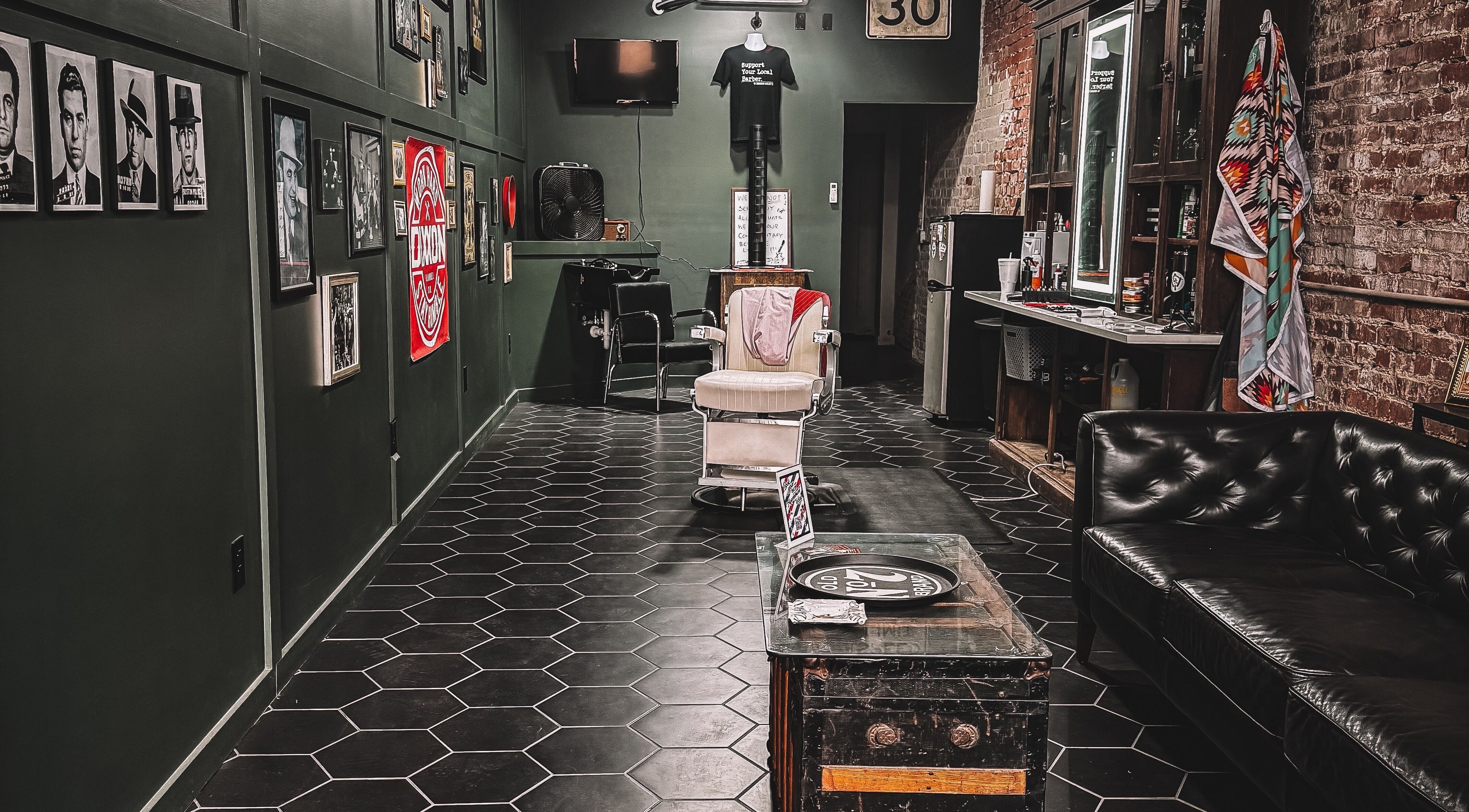Retro interior of 46 Barber Society in Sperry, Oklahoma, with classic chair and decor.
