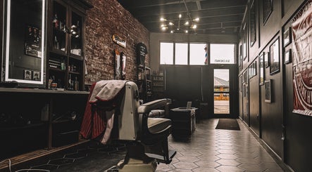 A classic barber chair at 46 Barber Society, Sperry, Oklahoma, US, exuding a vintage rustic charm.