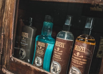 Reuzel grooming products display at 46 Barber Society in Sperry, Oklahoma, US.