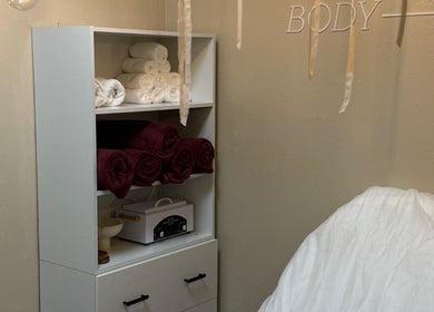 Cozy relaxation corner at Miro Beauty Clinic, Dublin15, County Dublin, IE, featuring plush towels and massage chair.